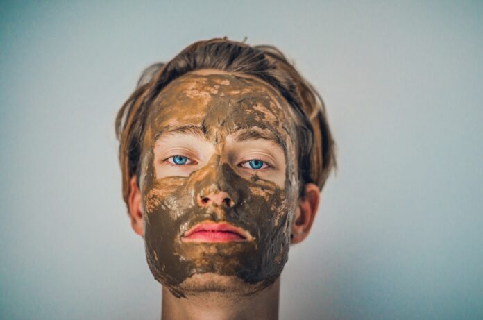 Photo by Isabell Winter shallow focus photography of men's muddy face