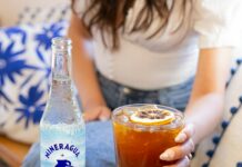 건강한 식사와 운동: 전반적인 체력 향상을 위한 조화 a woman sitting on a couch holding a glass of soda