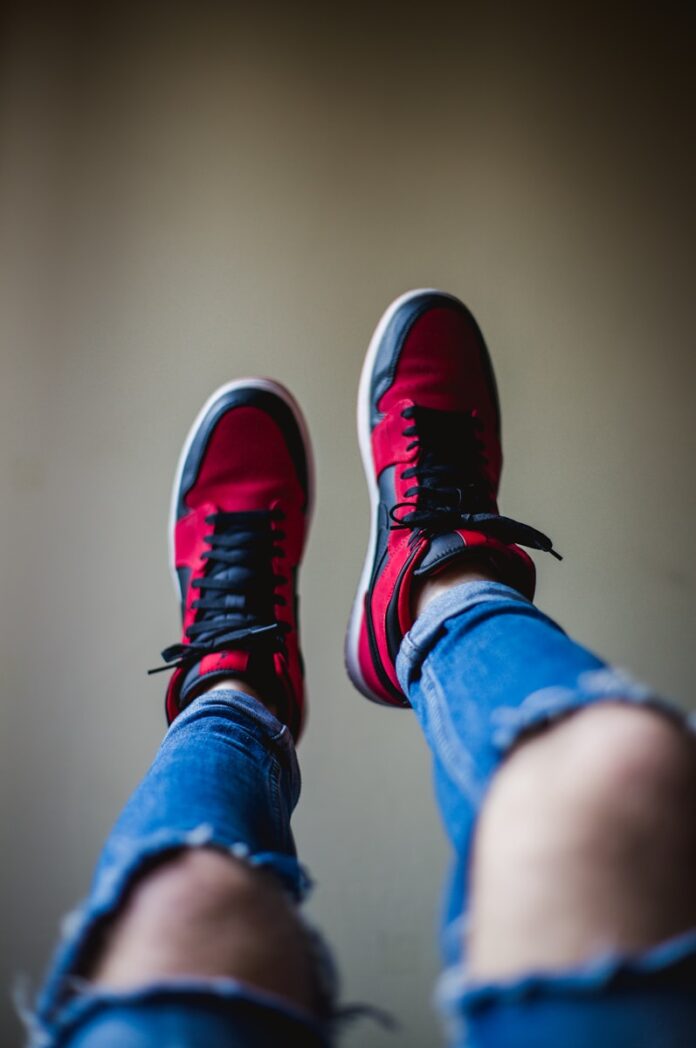 Photo by Matteo Vistocco shallow focus photography of red-and-black shoes