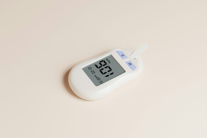 Photo by Mockup Free a digital thermometer on a white surface